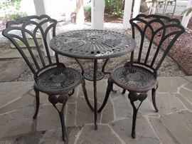 Perfect for gossiping, an ice cream table for two.      You should hear about the next door neighbors! 