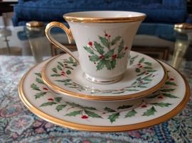 Timely 24-piece set of Lenox  "Holiday" china, includes dessert plates, cups and sassy saucers.                      You have to bake your own cookies to lure that hot Santa to your warm chimney.