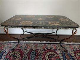 Gorgeous and unique 19th Century cast iron coffee table, with hand painted top and gilt swan head atop each leg.