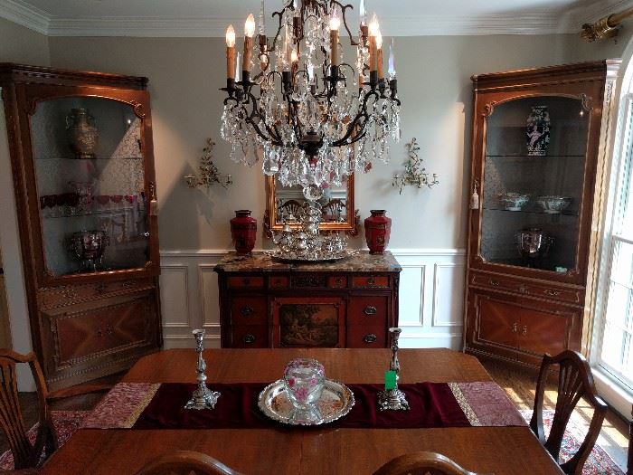 Wider view of the dining room, with an antique pair of lighted corner cabinets from Barcelona.