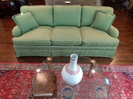 Beautifully upholstered green damask couch, with corded gimp and fringed pillows - very sha sha sha!