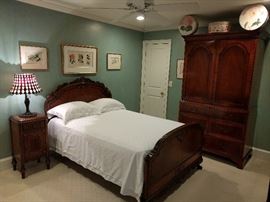 One of the upstairs bedrooms, with a vintage Berkey & Gay full sized bed, matching nightstand and mirror (next pic).                                                                   Vintage, Tiffany-style stained table lamp, with glass shade and metal base - purdy when lit!                                                    Kinda like you, on a good Saturday night. Thomasville banded mahogany entertainment armoire.