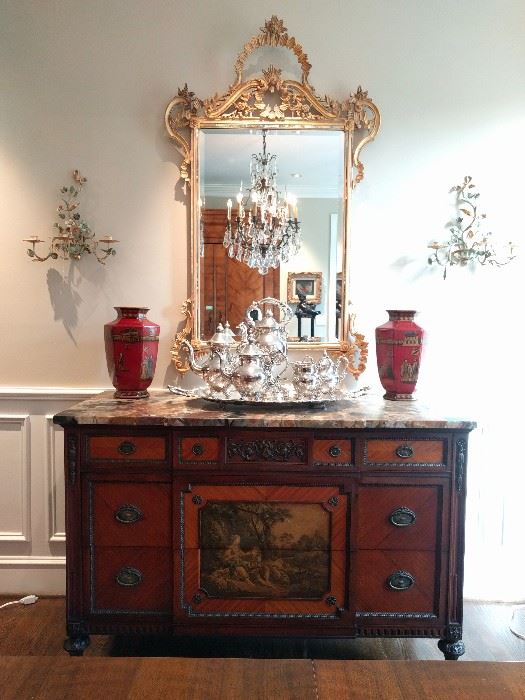 1930's mahogany chest, hand painted, with marble top, measures 4' 5" W  x 1' 11" D x 35" T, silver plated tea set, pair of red Asian vases, flanked by a pair of metal Italian toile wall sconces, vintage LaBarge Gilt wood mirror.