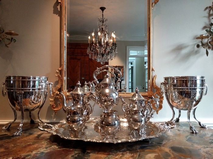 English silver plated tea set, reflected in a vintage LaBarge gilt wood mirror, flanked by a pair of exquisite French silver plated champagne coolers. 