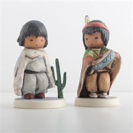 Goebel "The Children of DeGrazia" Figurines: A pair of figurines from The Children of DeGrazia collection by Goebel. This pair offers Pima Indian Drummer Boy and The Blue Boy. Both are marked “Goebel” to their undersides.