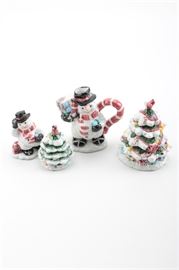 Holiday Themed Ceramic Kitchenware: A small collection of holiday themed kitchen decor. Featured are a snowman shaped teapot and a Christmas tree jar, both marked to the verso with “Omnibus”. Also included are a salt and pepper shaker set, depicting a snowman and Christmas tree.