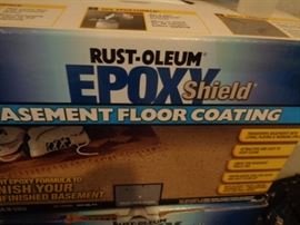 Many boxes of Epoxy Shield floor coating