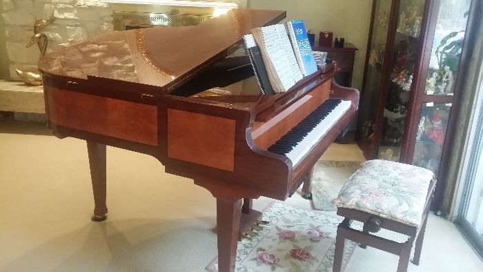 Player piano in working condition.