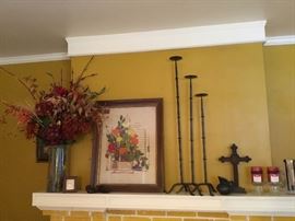 Picture is a crewel embroidery that has been framed' flowers in tall vase; set of 3 tall candle holders - currently on mantle.