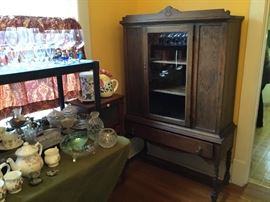 Antique glass front China cabinet.
