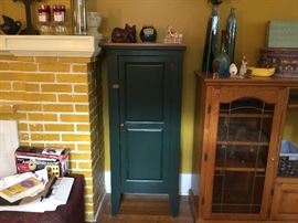 Green painted cabinet with shelves