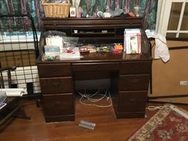 Large rolling cart next to roll top desk