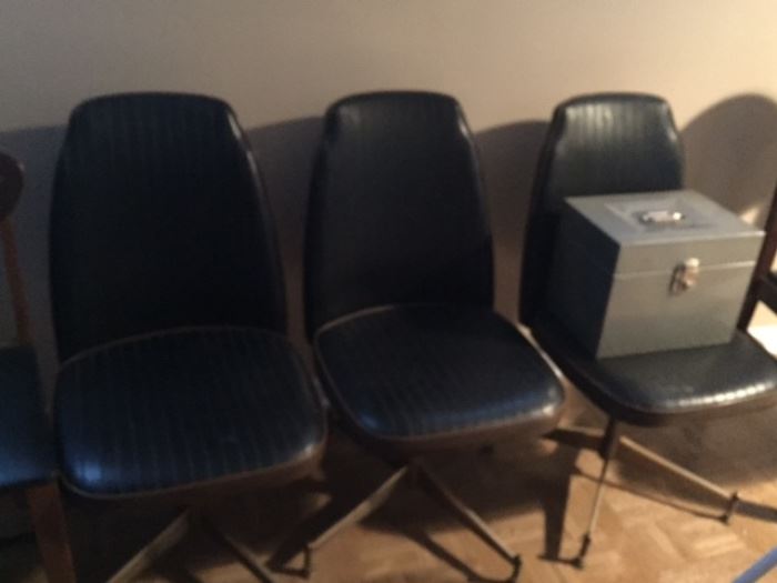 Three mid century modern chairs that belong to upstairs dinette set