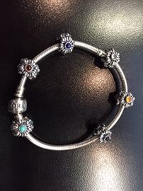 This is a retired Pandora bracelet. Flowers with stones $150, Not at this sale, ask Kathy for Info. This bracelet and the one in the next picture are at our Hawthorn Woods sale.