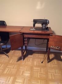 Singer sewing machine and cabinet 1950's $200