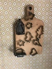 Nice group of early cutters on early wooden cutting board.