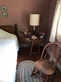 One of two maple drop leaf side tables.  Rag rug.  Primitive rocker and smalls.