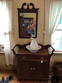 Lovely antique walnut commode with towel bars with original surface.  Ironstone pitcher and bowl.  C. 1940's Hepplewhite style mahogany mirror. 