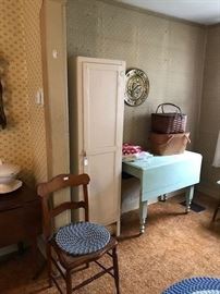 Early chair with birdseye maple.  Chimney kitchen cupboard.  Painted dropleaf table.  Picnic baskets.  Vintage linen.