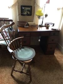 Gardner, Mass. manufactured Hitchcock style chair along with another in background - armless.  Maple desk.  Single student lamp, C. 1950's.  