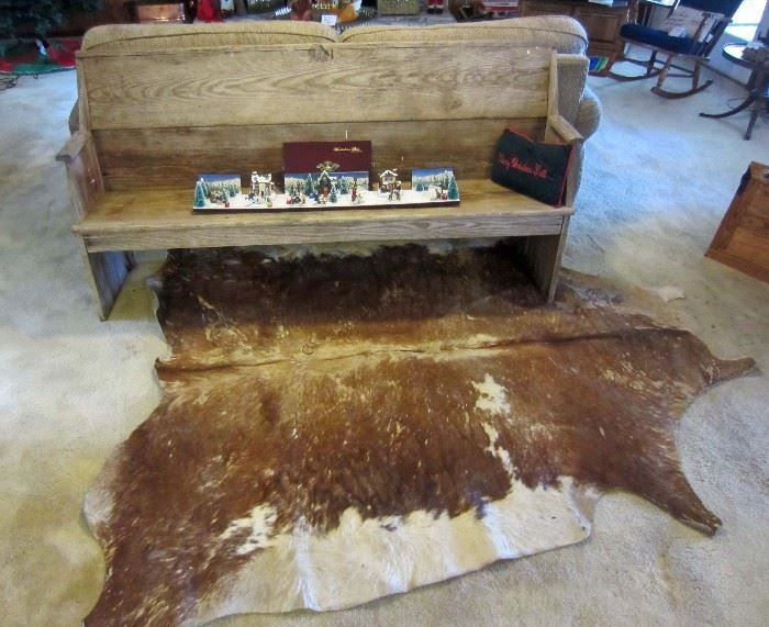 Old wood bench (pew?), cow hide (sold), and Christmas scene