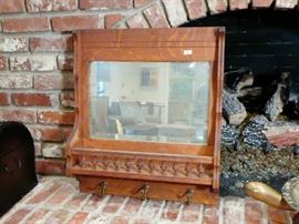 Beautiful antique wall hanging mirror and coat hanger.