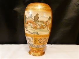 Satsuma vase  Japanese 1900-1920 earthenware with elaborate polychrome enamel decorations consisting of panels of landscape, floral and textile patterns with gold borders