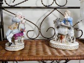 meissen figurines one depicting an 18th century man sitting on a chair with a purple cushion has a colorful costume holding a hat in his hand  German late 19th century  hard-paste porcelain polychrome details  has Meissen blue crossed swords mark a "star" mark triangular shape mark and incised number 11 under glaze on reverse side.