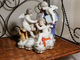 Meissen figurine three angel cherubs two sitting one standing studying a book
