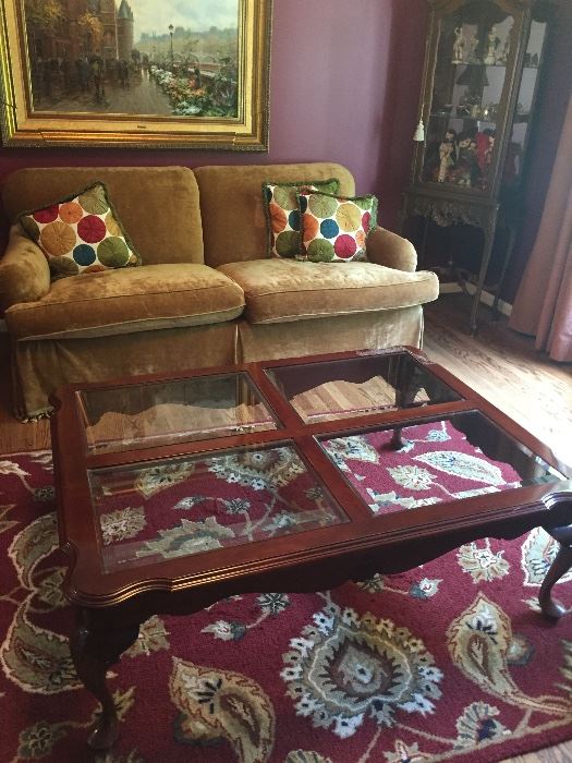 Couch, curio Cabinet, square coffee table, and wool area rug