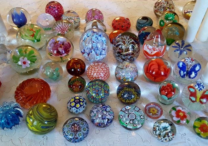 Hundreds of glass paperweights
