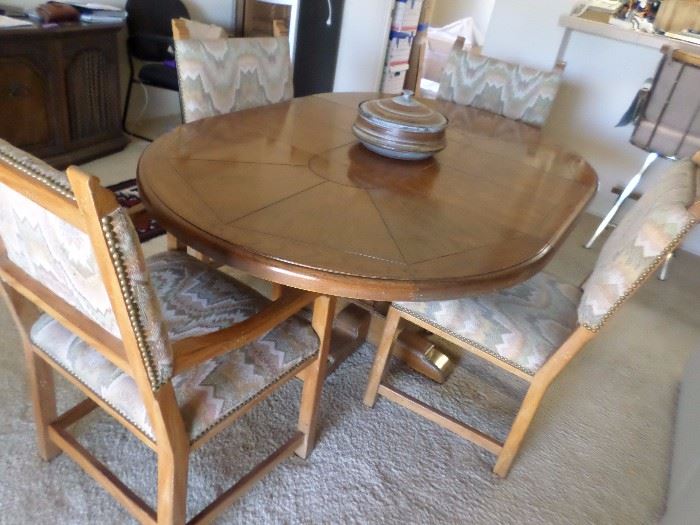 Drexel Dining  Set, round table with leaf becomes oval. 4 chairs (2 captain) base of table has brass accents $350 for the set