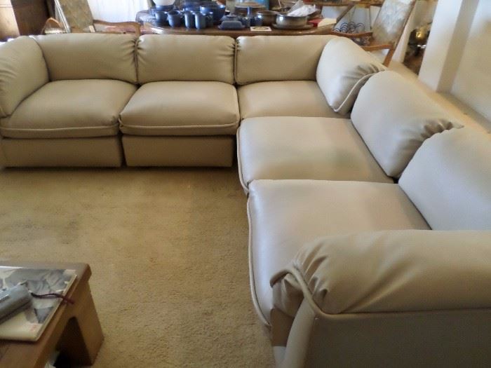 Low mid-century L shaped sofa grouping, can be configured to your liking. Faux (?) Leather