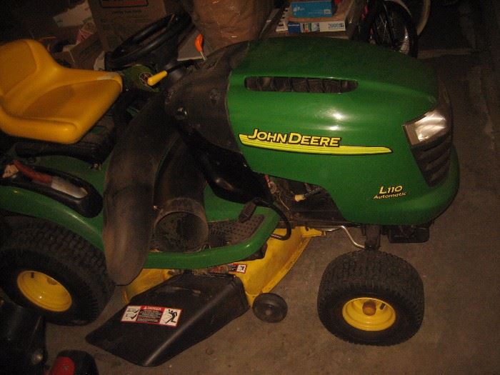 SOLD John Deer Tractor with Leaf Pick up and extra blades. Low hours. 