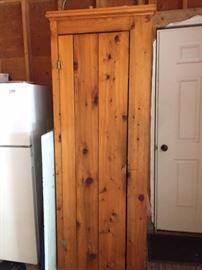 Tall pine storage cabinet