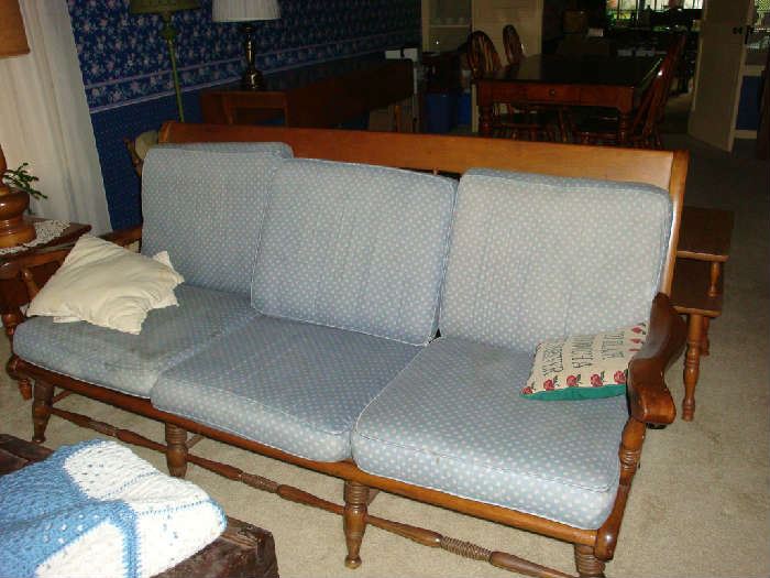 Wooden couch with cushions