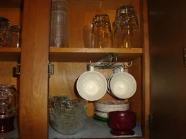 Kitchen cabinets full of things