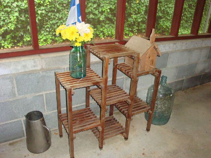 Plant stand and vintage bottles