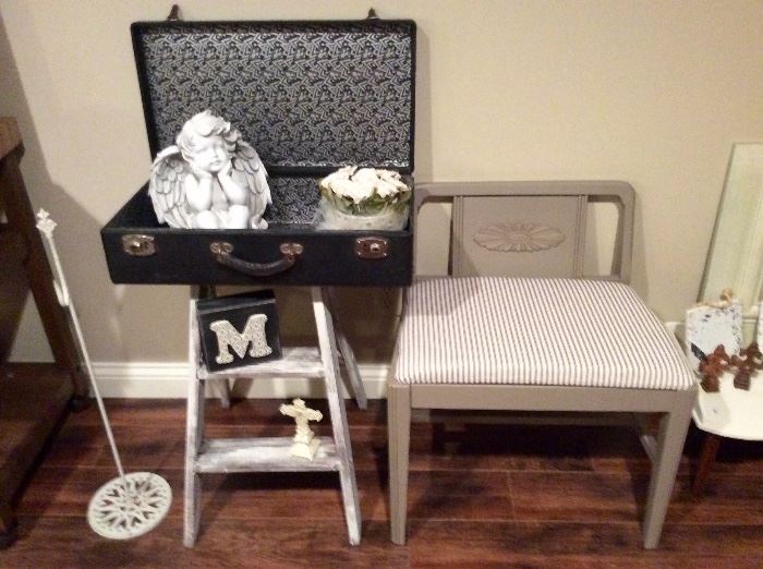 Vintage charm! Check out this sweet little ladder, suitcase, and chalk painted vanity stool.
