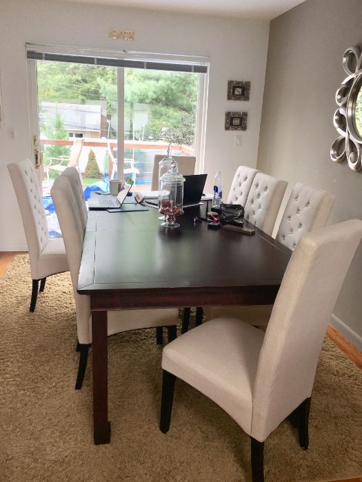 Contemporary dining room table with 8 upholstered chairs 