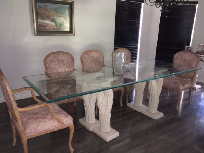 Elegant glass table with 8 matching chairs and matching glass buffet table 