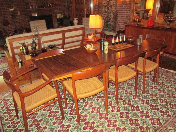 Mid Century J.L. Moller Teak Wood Dining Set made in Denmark. Designed by Niels Otto Moller. Chairs are Model 75. Includes 6 Dining Chairs, 2 Arm Chairs, Sideboard & Serving Cart.