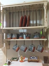Plate rack, blue and white coffee mugs, cream and sugar 
