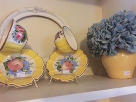 Yellow and white tea cup and saucers 