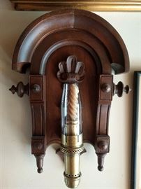 Love this ol' wall hanging thing. It's a Victorian wooden sconce, with a candle ribbed for pleasure, in a brass socket, by The Safety Co., New York.