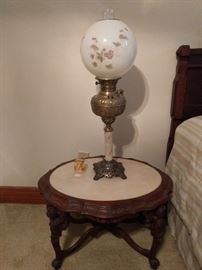 One of a zillion Gone with the Wind lamps, on a marble-topped side table.