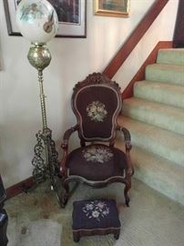 We all need a Victorian armchair, with matching ottoman, lovingly hand embroidered, paired with a nicely filagreed brass floor lamp.
Makes a guy feel especially butch in his man cave. I know the hand painted guitar is a rare Gretsch, Jimmy D'Aquisto, or Kramer...