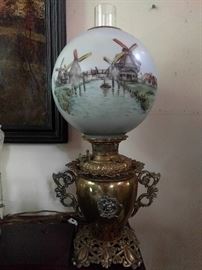 I don't love GWTW lamps, but this one is a different story. The detail on the brass base is extraordinary and the hand painted windmills set this apart from your pedestrian "roses and cherubs" edition.