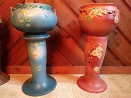 Here's something you don't see every day, a pair of Roseville pedestals, WITH pots.                                     You usually see these separated, due to rambunctious children, wild house pets or drunk spouses;                    L = Columbine 655-10", R = Apple Blossom 303-10".