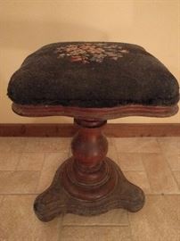 One of two hand embroidered piano stools.